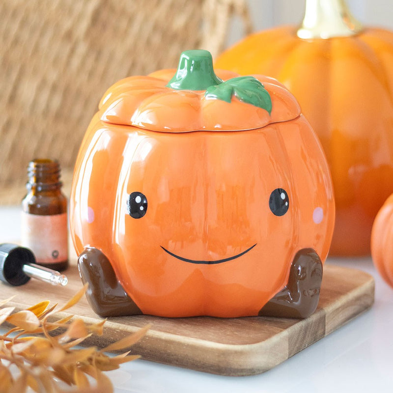 Pumpkin shaped oil burner with cute smiley face design
